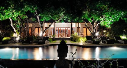 Stunning beachfront villa with pool, lush gardens, staff, and top activities!