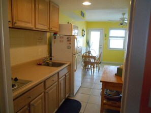 Fridge, microwave, stovetop, coffee/tea maker