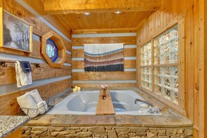 Bathtub, jetted tub, hair dryer, towels