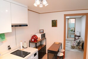 Fridge, microwave, stovetop, coffee/tea maker