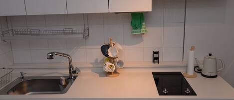 Fridge, microwave, stovetop, coffee/tea maker