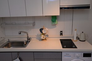 Fridge, microwave, stovetop, coffee/tea maker