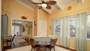 A dining room with a round table, four chairs, a ceiling fan, and a window with curtains. - Come to the cottage! 3BR2BA - Bethany West. Pool, pickleball, tennis, gym. Pets! (Bethany Beach)