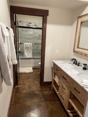 Combined shower/tub, hair dryer, towels, soap