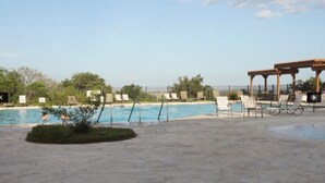 A swimming pool area with lounge chairs and a pergola. - The Place to Relax in San Antonio, only 10 min away from Six Flags Fiesta Texas! (San Antonio)