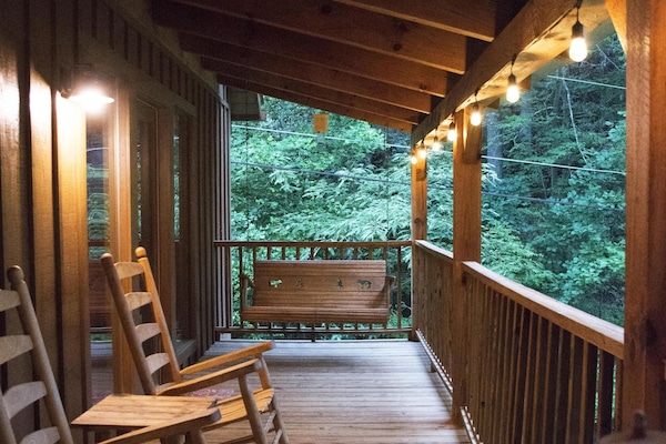 Porch wraps around 2 sides of the chalet. Hot tub is located on the side porch.