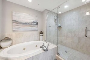 Combined shower/tub, hair dryer, towels, soap