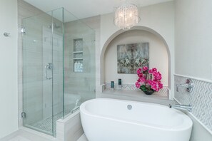 Combined shower/bathtub, hair dryer, towels, soap