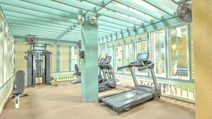 A gym with treadmills, exercise bikes, and weight machines. - Walk to beach, indoor/outdoor pools, washer/dryer (Hilton Head Island)