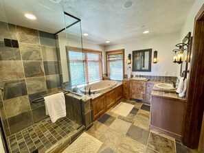 Bathtub, jetted tub, hair dryer, towels