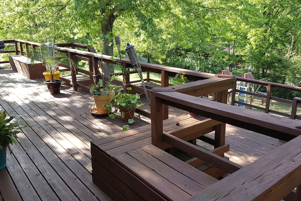 upper deck with gas grill and bench seats