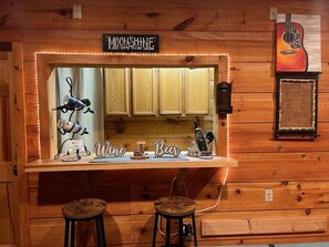 Relax with a drink at the Moonshine Sippin' Station, where wine and beer are always available.