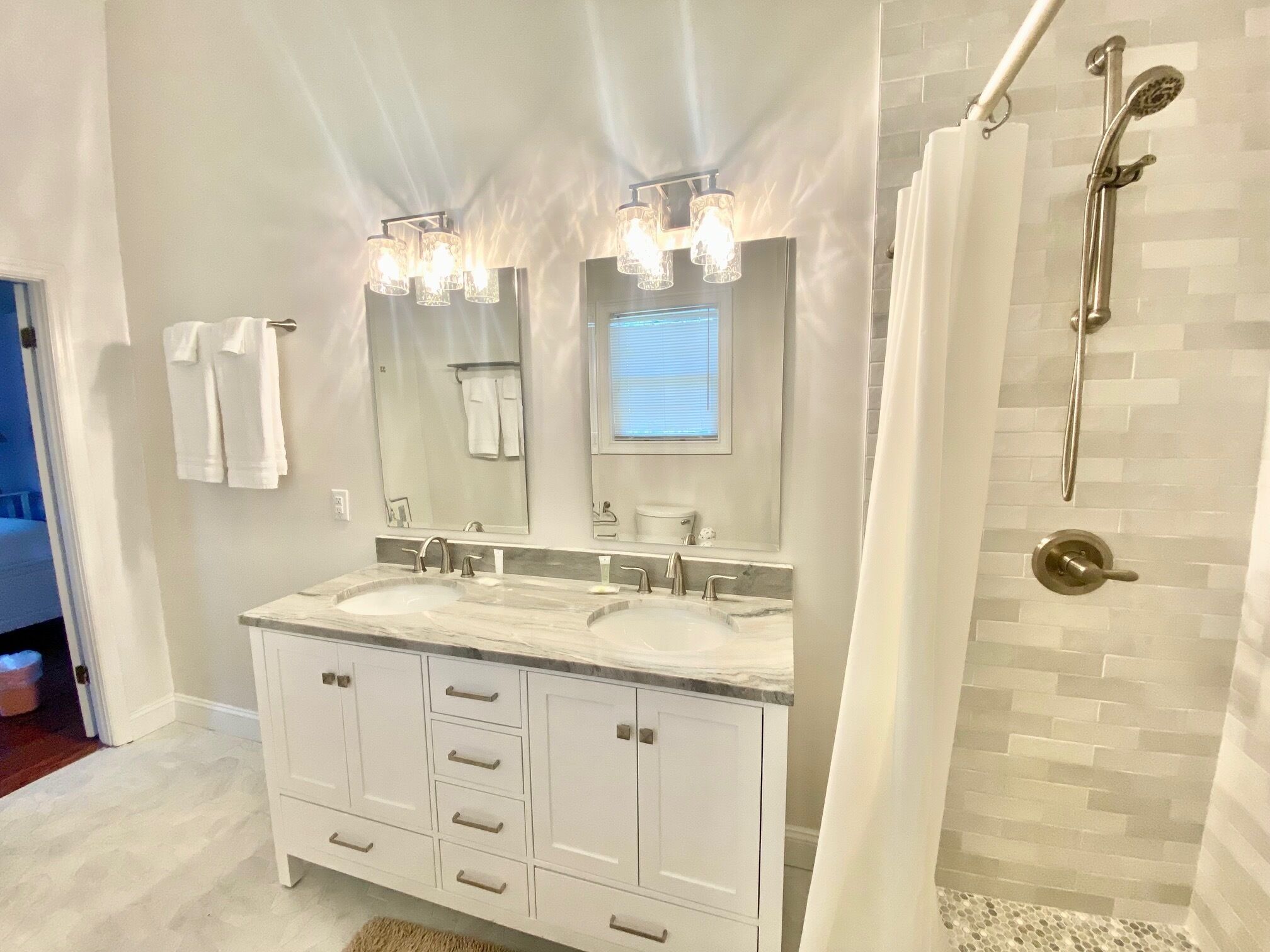 Combined shower/tub, hair dryer, towels, soap