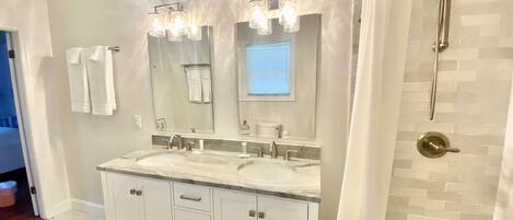 Combined shower/tub, hair dryer, towels, soap