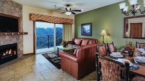 TV connectée, cheminée, lecteur de DVD, table de tennis de table