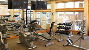A gym with treadmills, weight machines, and dumbbells. - 2BR with Great Mountain views Master Suite and JR suite (Gatlinburg)