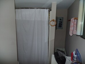 Combined shower/bathtub, hair dryer, towels, soap