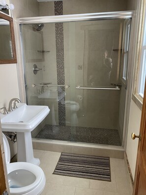 Shower, hair dryer, towels, soap