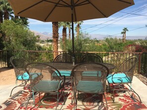 Pool Patio View to The City Lights and Mountains. Umbrella Table & Seat Cushions