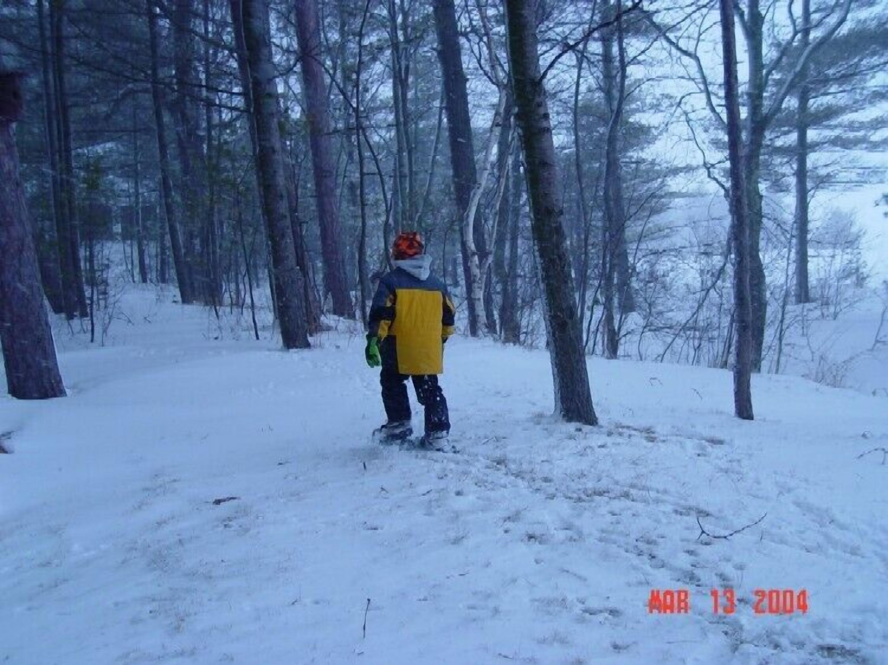 A person in a snowy forest.