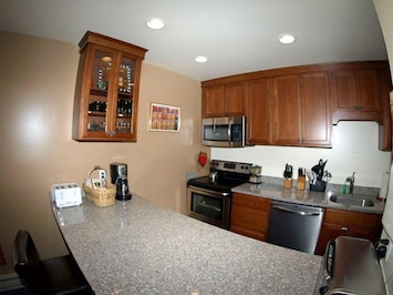 New cabinets that are soft closing bar stools to counter, stainless appliances