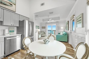 Enjoy a spacious living area with a dining table, kitchen, and cozy seating area.