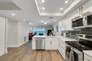 Fridge, microwave, oven, stovetop - Anthony Beach Cottages - Gulfview Condo - 2 bedroom gulf front with heated pool (Bradenton Beach)