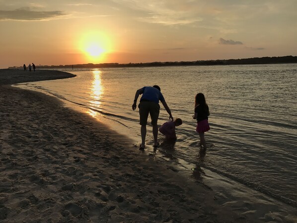 Enjoy a serene beach experience with gentle waves lapping at the shore.