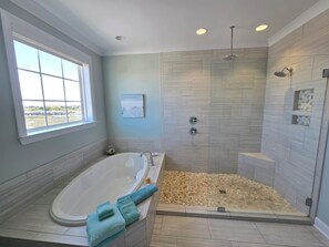 Combined shower/tub, hair dryer, towels, soap