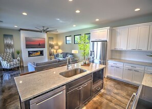 Enjoy meals in the central island kitchen with a dishwasher and dining area.