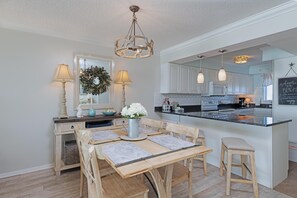 Enjoy cooking and dining in this well-equipped kitchen with a central island and ample counter space.