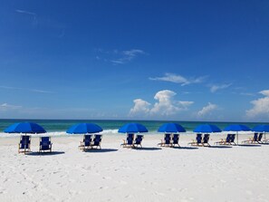 On the beach, sun-loungers