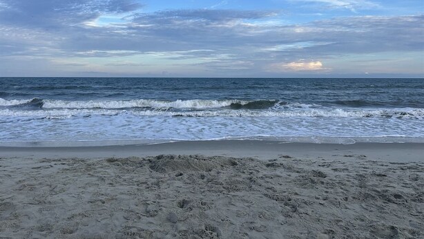 A beach with waves and a clear sky. - Beach House on Channel, Private dock,Walk to Beach (Cherry Grove)