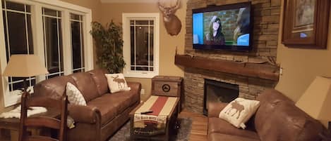 Smart TV, chimenea, reproductor de DVD y futbolito