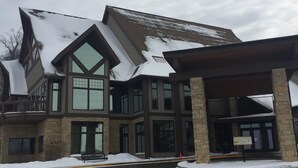 A multi-story building with a snow-covered roof and large windows. - Newly remodeled, Located in Galena Territories. Small dogs OK under 25 LBS  (Galena)