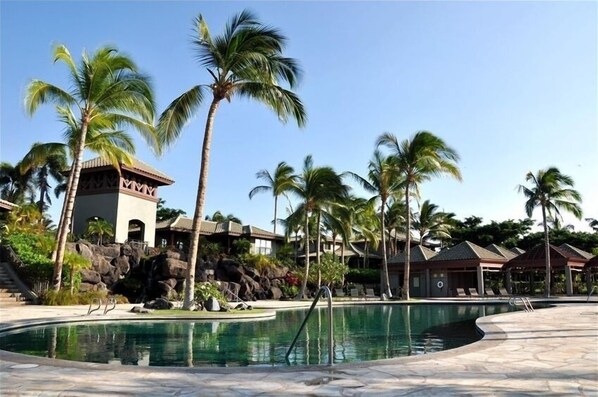 A lap pool, pool loungers