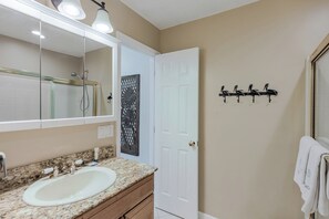 Bathtub, hair dryer, towels, soap