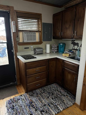 Fridge, microwave, stovetop, coffee/tea maker