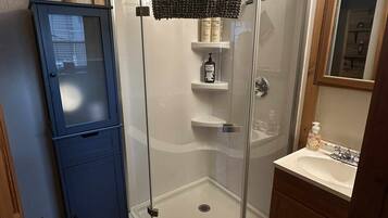 Shower, hair dryer, towels, soap