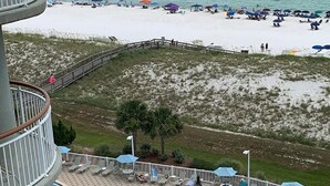 A pool area with a view of the beach and ocean. - Beach Colony West 8E Beautiful Gulf Views from over sized balcony (Navarre)