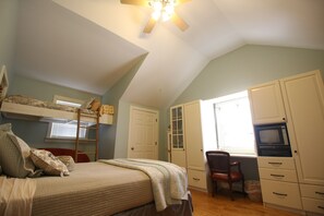 A bedroom with a bunk bed, a desk with a computer, and a window with blinds. - Goldberry Woods Home on 30 acres-Pool/River/Woods/Trails/Farm. 1 mile to Beach! (Union Pier)