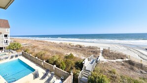 A beachfront property with a swimming pool, beach access, and a view of the ocean. - Beautiful Oceanfront Condo On 4th Floor - Steps From The Beach. Linens Incl. !!! (Surfside Beach)