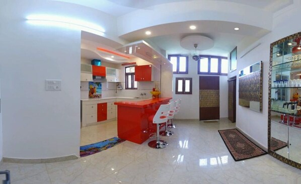 Enjoy cooking and socializing in this well-equipped kitchen with a central island and bar seating.