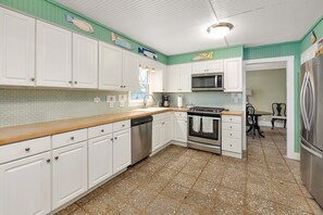 Enjoy cooking in this well-equipped kitchen with a dishwasher, oven, and microwave.