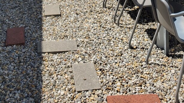An outdoor patio with a white umbrella, a table, and chairs. - August 22-29 Available Due to Cancellation!!! Accepting bookings for Summer 2027 (Beach Haven)