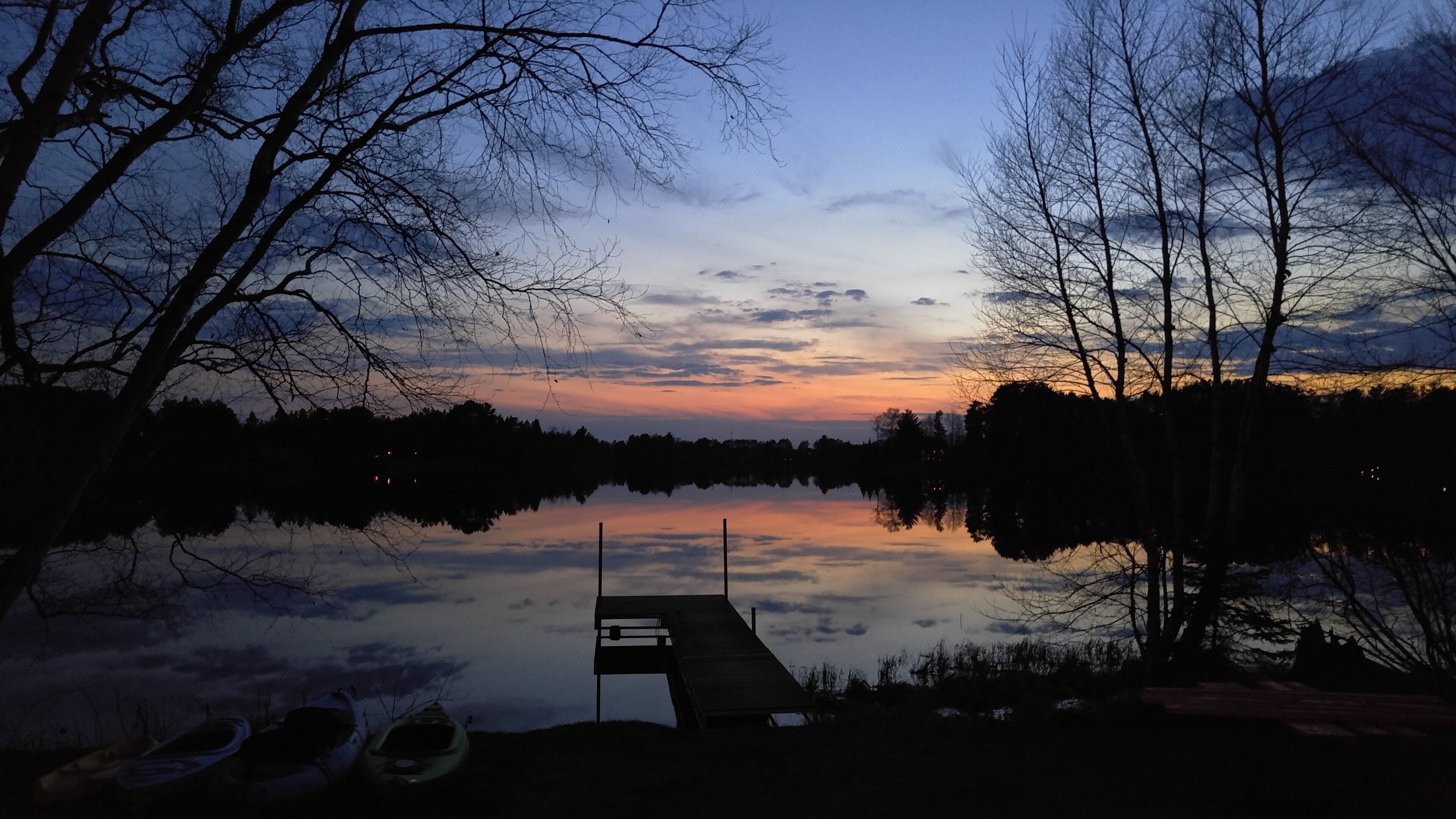 Calm waters just after an early spring sunset.
