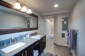 Combined shower/tub, hair dryer, towels, soap