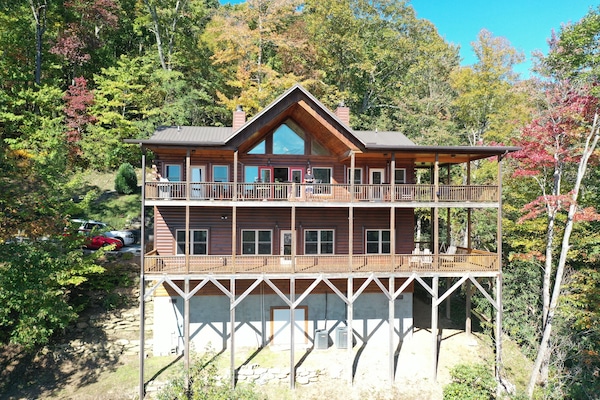 SUPER LARGE WRAP DECKS ON TWO LEVELS. ROCKING CHAIRS, SWINGS, HAMMOCK.