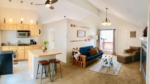 A modern apartment with a kitchen, living area, and a balcony. - Best Views in Anchorage! Totally Private, Romantic, and Family Friendly Suite! (Anchorage)