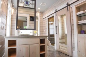 Bathtub, hair dryer, towels, soap - The Stone House at Black Dog Salvage (Roanoke)